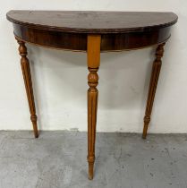 A Demi Lune side table on turned and fluted legs with string inlay to the top (H76cm W77cm D39cm)