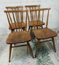 A set of four Ercol stick back chairs