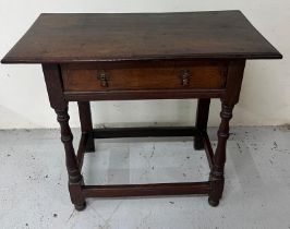 An 18th Century Oak side table with central drawer and drop handles.H 74cm x D 40cm x W 81cm