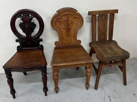 A selection of three chairs, to include: An Arts and Crafts style, a shield back oak hall chair