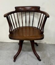 A mahogany stick back swivel Captain chair on castors Condition Report one of the stick backs is