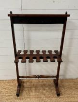 A Georgian style mahogany double sided boot rack