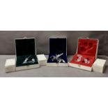 Three Swarovski crystal ornaments boxed and with display stands, Pegasus. Dragon and Unicorn,